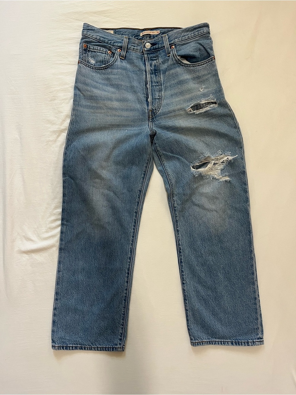 Levi’s distressed blue jeans